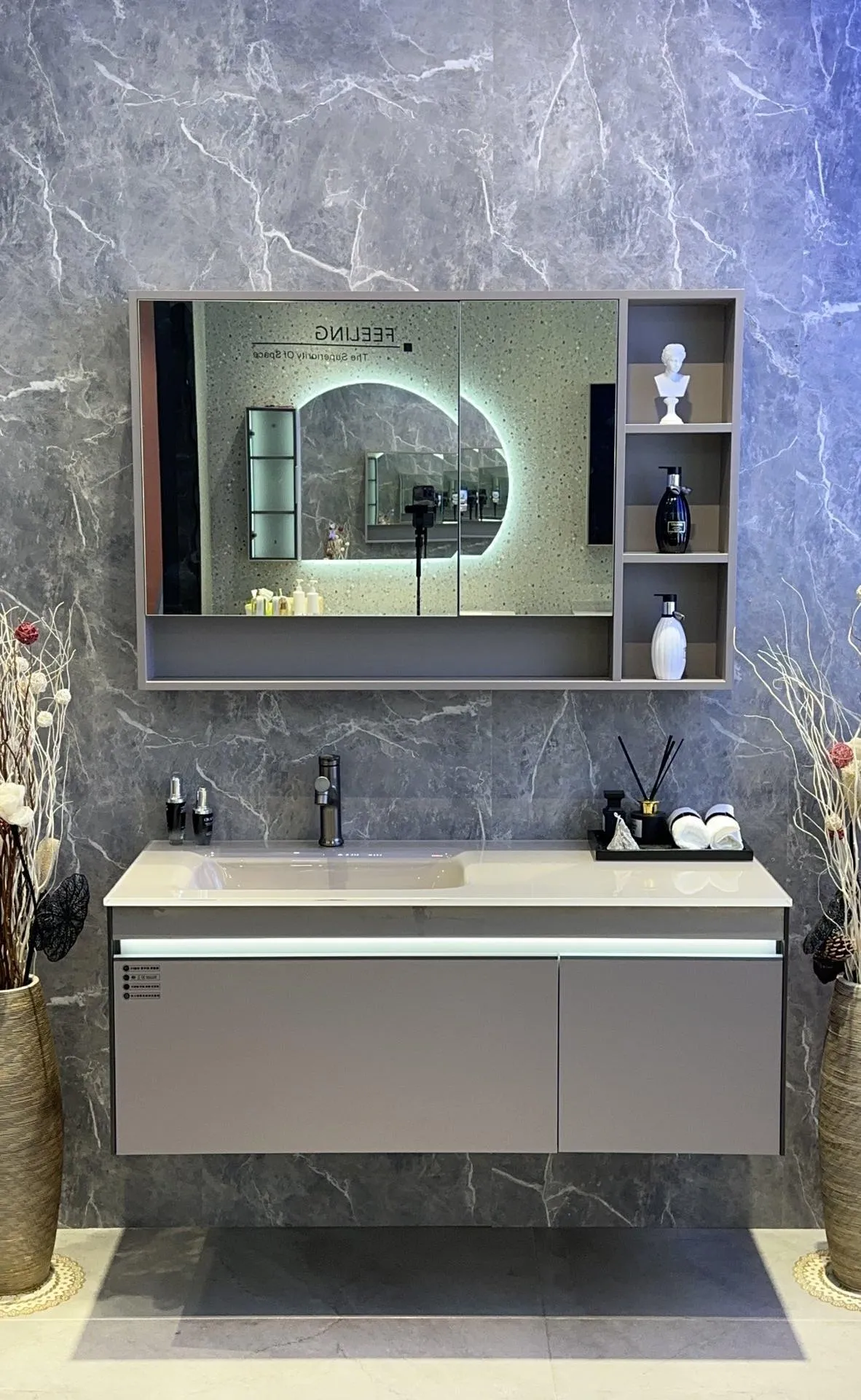 Terra 120 vanity: 120 cm sintered stone counter with one-piece basin above a stone-grey wall-hung cabinet.